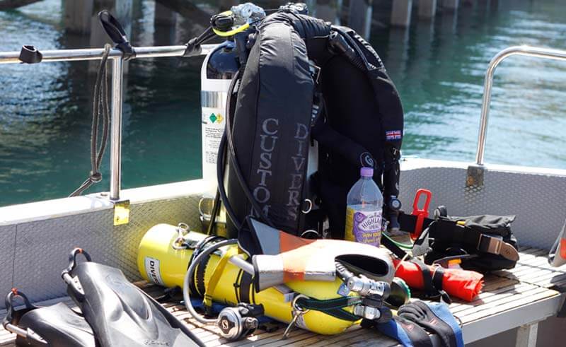 Scuba diving gear and air cylinder on a boat